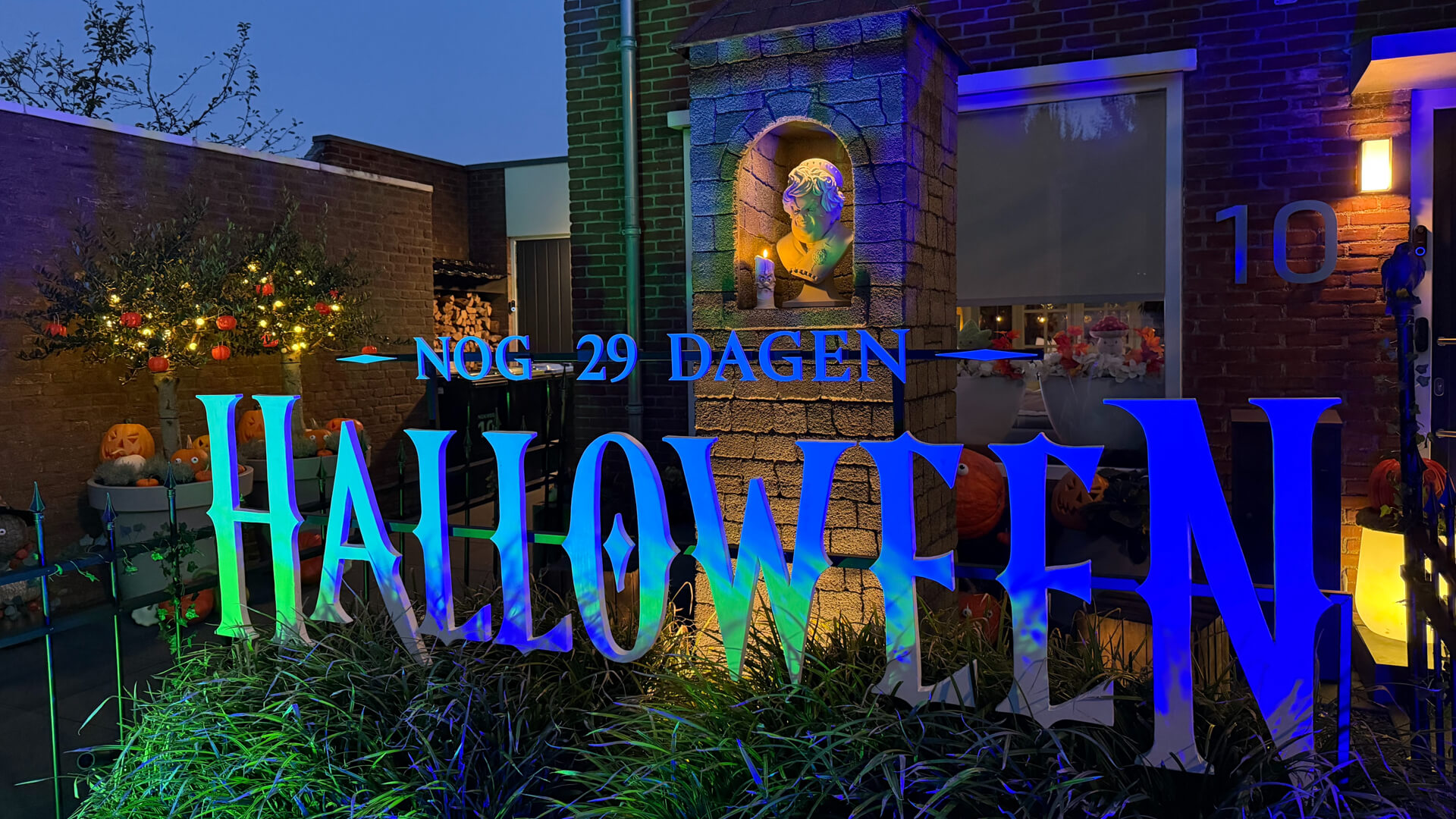 Front yard with giant lit-up Halloween letters