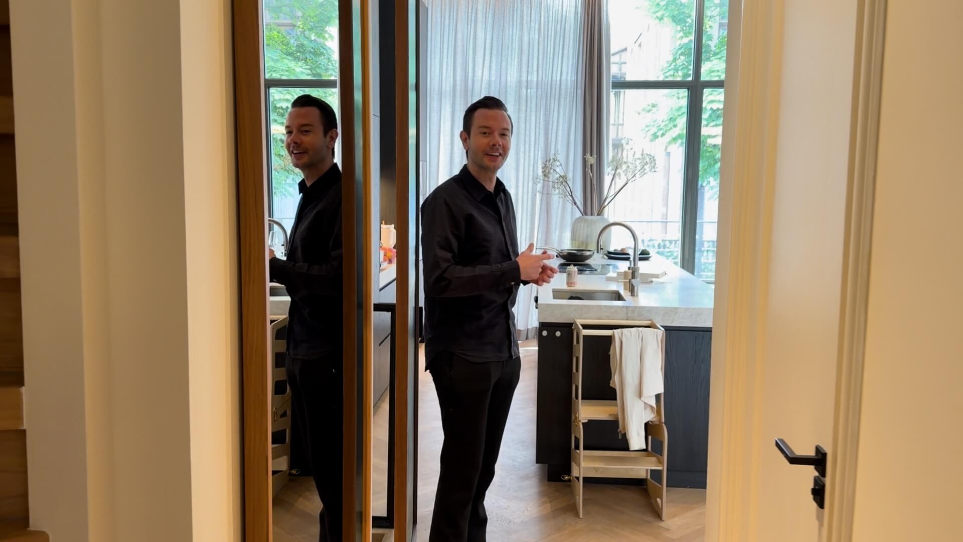 Sam Feldt standing in the kitchen of his Amsterdam home